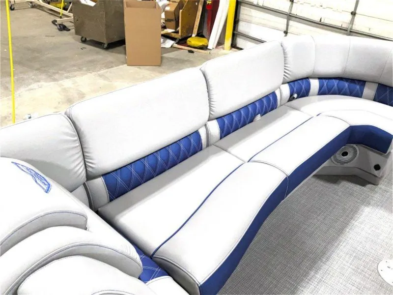 Slide: The Image of 2024 Bennington 25 RSR boat interior with luxurious gray and blue seating. - 16