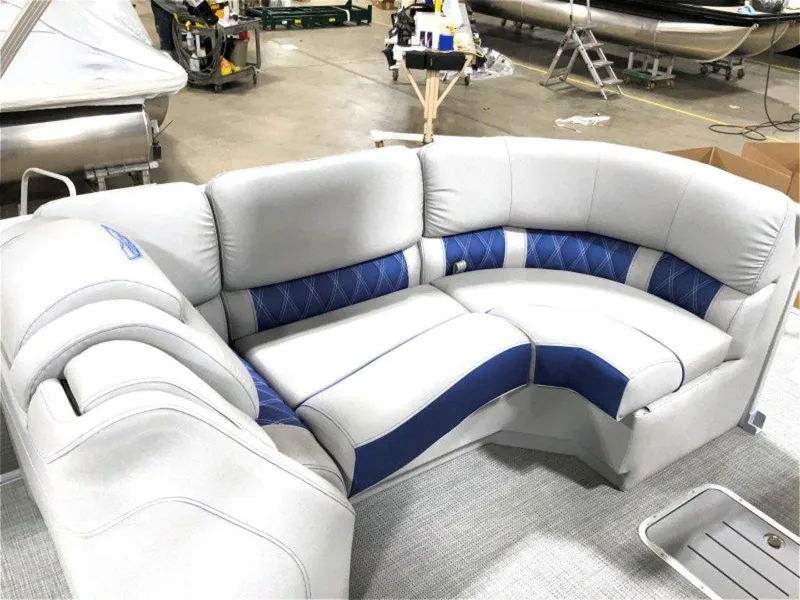 Slide: The Image of 2024 Bennington 25 RSR boat interior with luxurious gray and blue seating. - 2