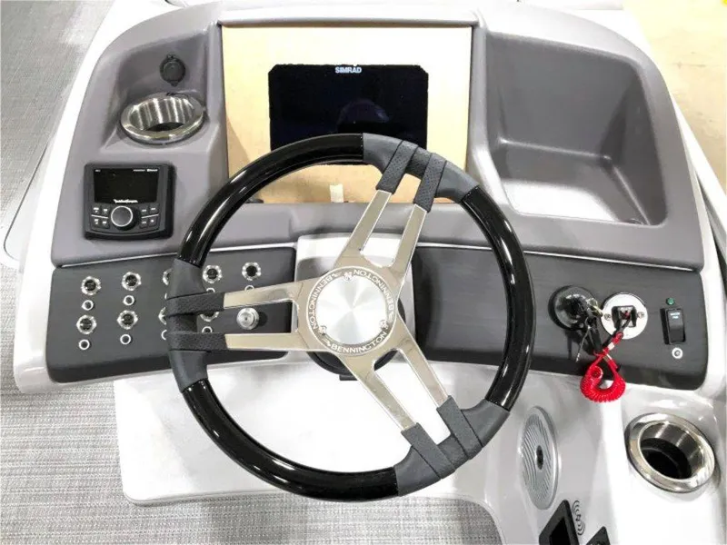 Slide: The Image of 2024 Bennington 25 RSR boat dashboard with steering wheel and control panel. - 6