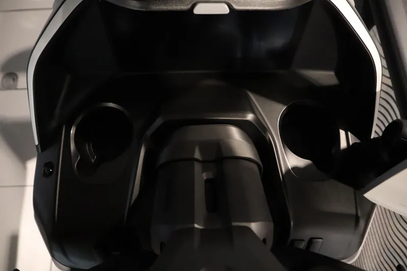 Slide: The Image of 2025 Sea-Doo Switch Cruise Limited 21 dashboard with cup holders and controls. - 13