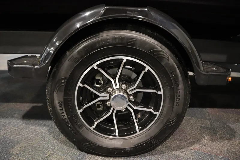 Slide: The Image of Close-up of a 2025 Sea-Doo Switch Cruise Limited 21 trailer wheel. - 31