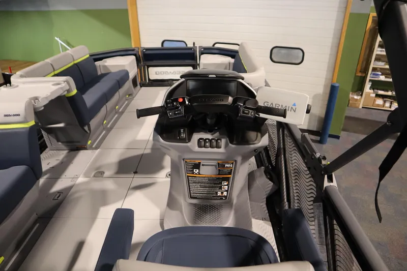 Slide: The Image of 2025 Sea-Doo Switch Cruise Limited 21 interior with Garmin navigation system and spacious seating. - 9