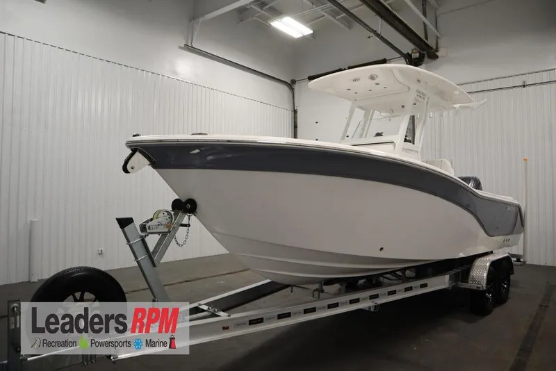 The Image of 2025 Sea Fox 248 Commander boat on trailer in indoor showroom. - 1