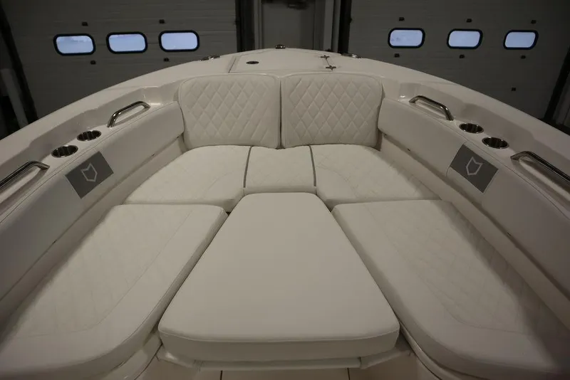 Slide: The Image of 2025 Sea Fox 248 Commander boat with luxurious white seating and cup holders. - 11