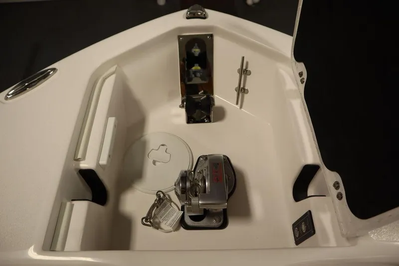 Slide: The Image of 2025 Sea Fox 248 Commander anchor locker with winch and storage compartment. - 13