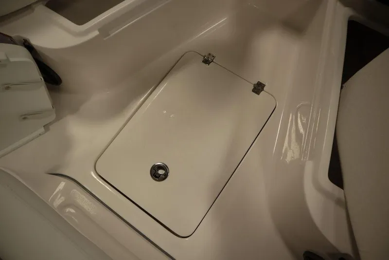 Slide: The Image of 2025 Sea Fox 248 Commander boat storage compartment with secure latch. - 18