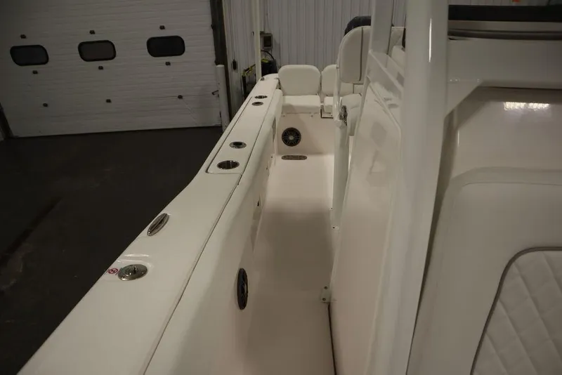 Slide: The Image of 2025 Sea Fox 248 Commander boat interior with rod holders and seating. - 21