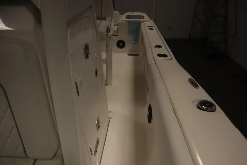 Slide: The Image of 2025 Sea Fox 248 Commander boat interior with storage compartments and rod holders. - 22
