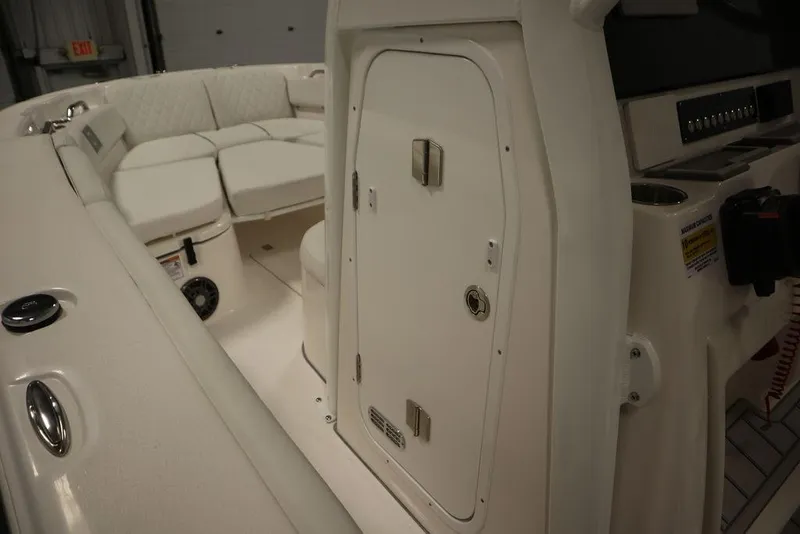 Slide: The Image of 2025 Sea Fox 248 Commander boat interior with seating and storage compartment. - 23