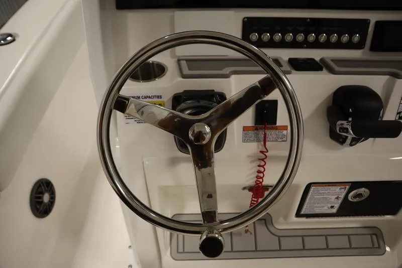 Slide: The Image of Steering wheel of 2025 Sea Fox 248 Commander boat with control panel. - 25
