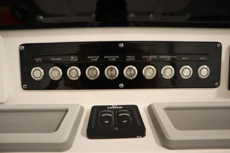 Slide: The Image of Control panel of 2025 Sea Fox 248 Commander boat with labeled switches and buttons. - 30