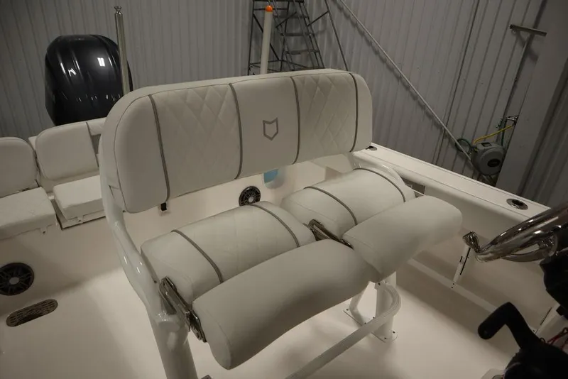 Slide: The Image of 2025 Sea Fox 248 Commander boat interior with cushioned seating and steering wheel. - 35