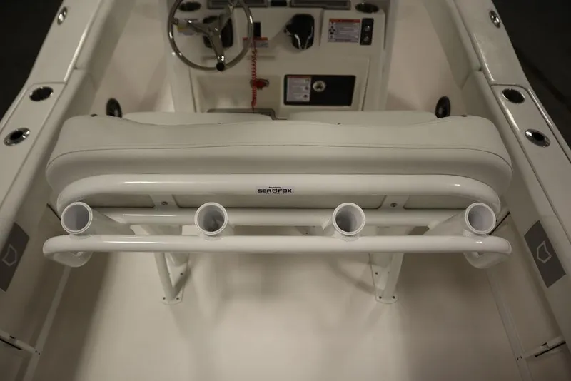 Slide: The Image of 2025 Sea Fox 248 Commander boat interior with rod holders and steering console. - 39
