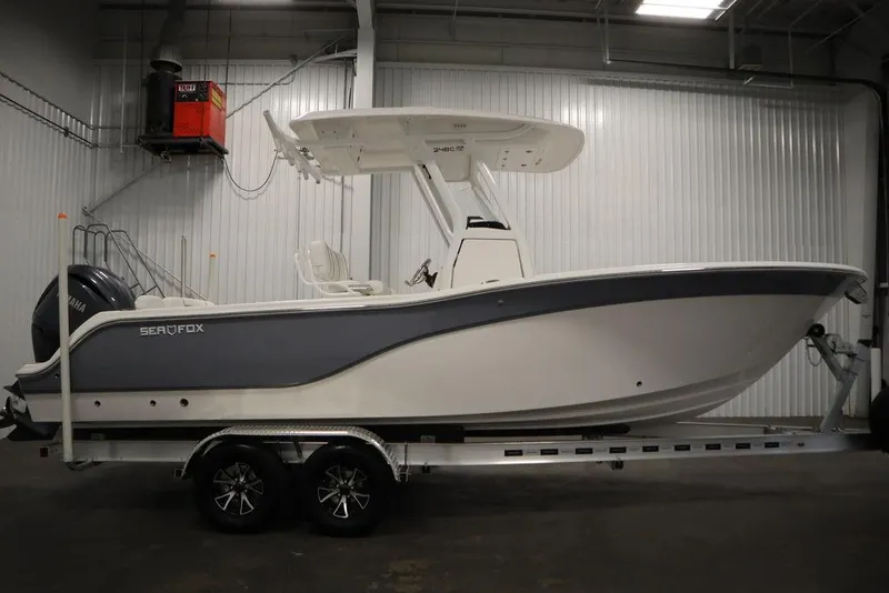 Slide: The Image of 2025 Sea Fox 248 Commander boat on trailer in indoor storage. - 4