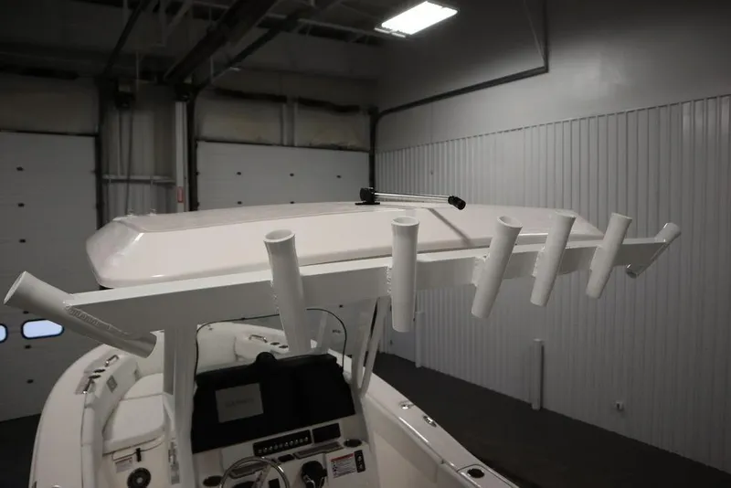 Slide: The Image of 2025 Sea Fox 248 Commander boat interior with rod holders and control panel. - 40