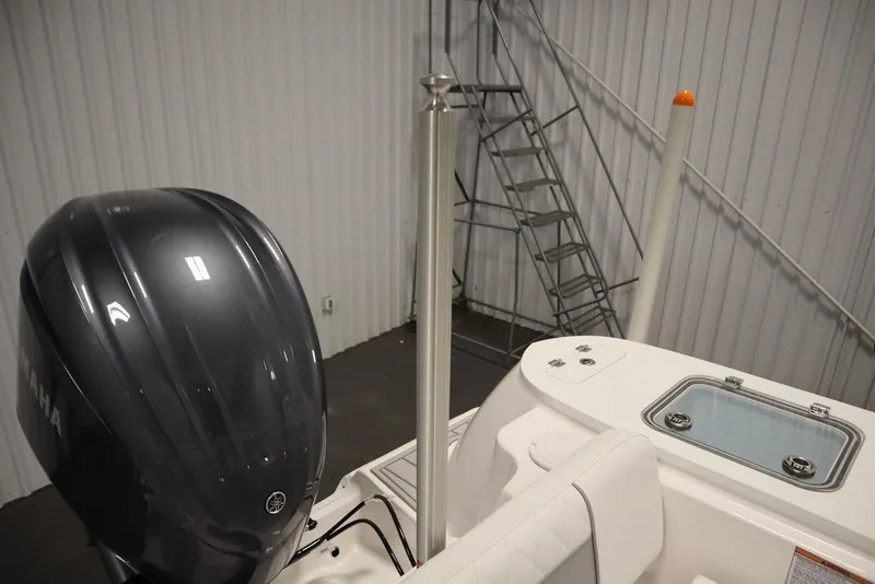 Slide: The Image of 2025 Sea Fox 248 Commander boat with Yamaha engine in a storage facility. - 47