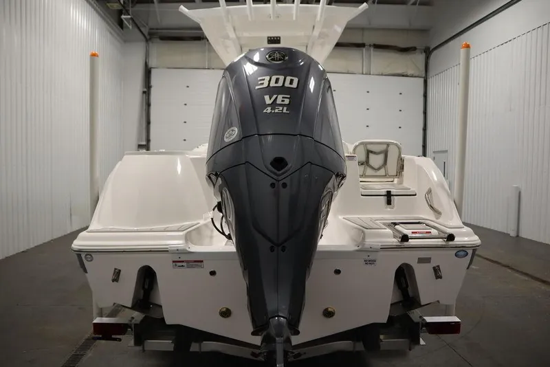 Slide: The Image of 2025 Sea Fox 248 Commander boat with 300 V6 engine in a storage facility. - 6