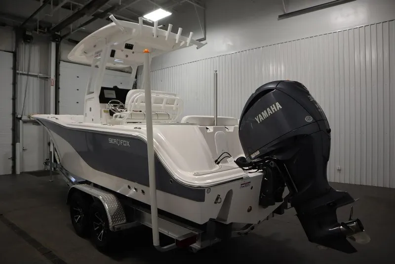 Slide: The Image of 2025 Sea Fox 248 Commander boat with Yamaha engine in indoor showroom. - 7
