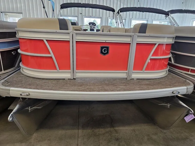 Slide: The Image of 2025 Godfrey SWEETWATER 2286 SB pontoon boat with red exterior in showroom. - 1