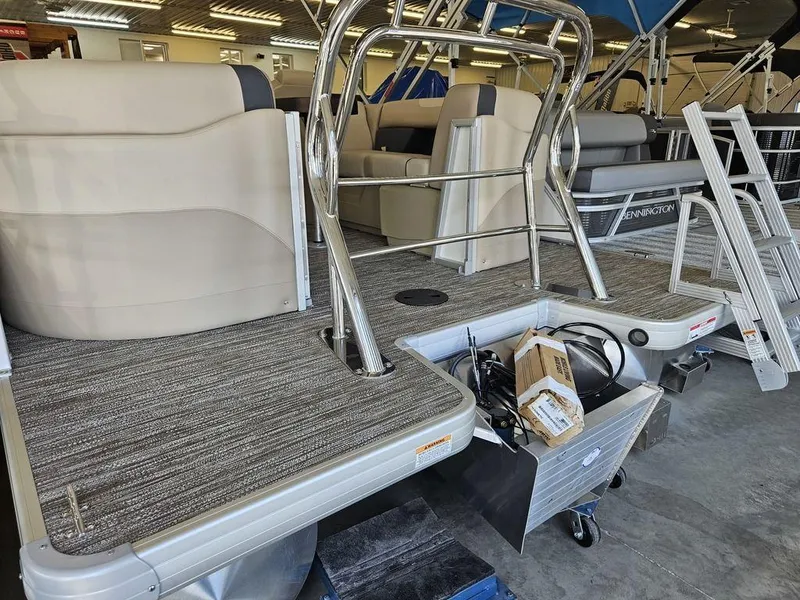 Slide: The Image of 2025 Godfrey SWEETWATER 2286 SB pontoon boat interior with seating and metal railings. - 10