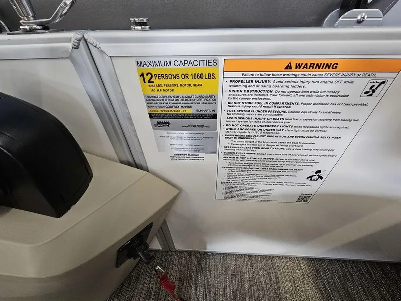 Slide: The Image of Warning label on 2025 Godfrey SWEETWATER 2286 SB boat, 12-person capacity. - 11