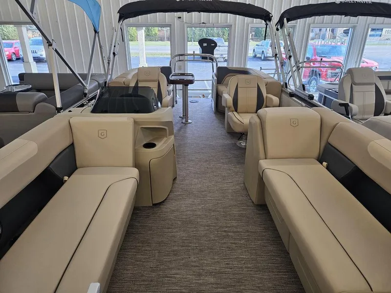 Slide: The Image of 2025 Godfrey SWEETWATER 2286 SB pontoon boat interior with beige seating and modern design. - 3