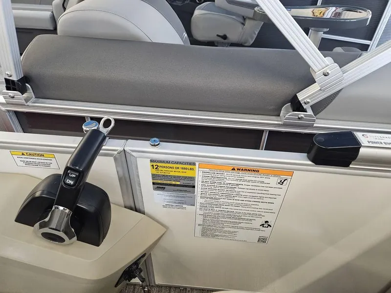 Slide: The Image of Close-up of 2025 Godfrey SWEETWATER 2286 SB boat controls and safety warnings. - 7