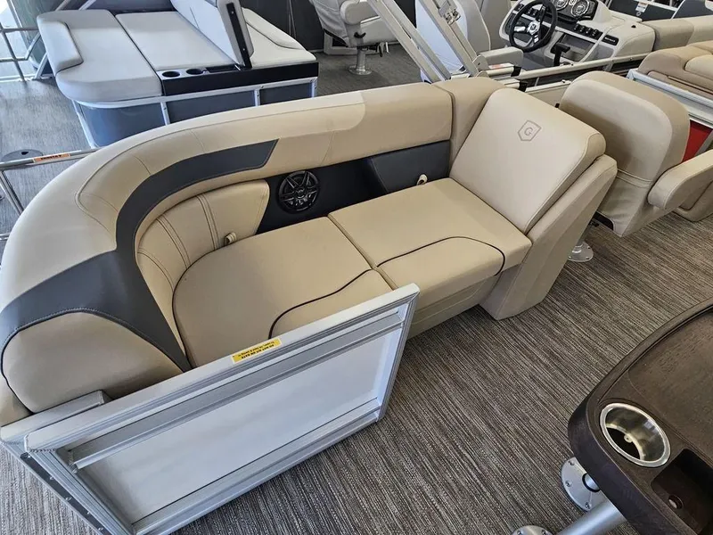 Slide: The Image of 2025 Godfrey SWEETWATER 2286 SB pontoon boat interior with beige seating. - 8
