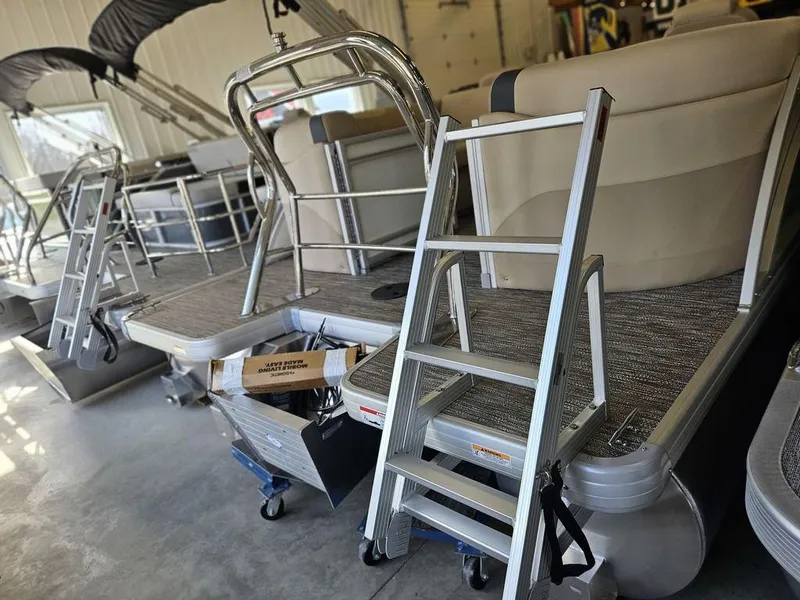 Slide: The Image of 2025 Godfrey SWEETWATER 2286 SB pontoon boat with aluminum ladder in showroom. - 9