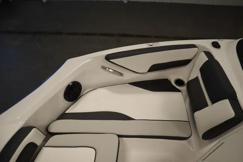 Slide: The Image of 2025 Yamaha Boats SX195 interior seating with sleek black and white design. - 14