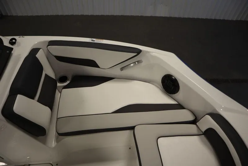 Slide: The Image of 2025 Yamaha Boats SX195 interior seating with black and white upholstery. - 16