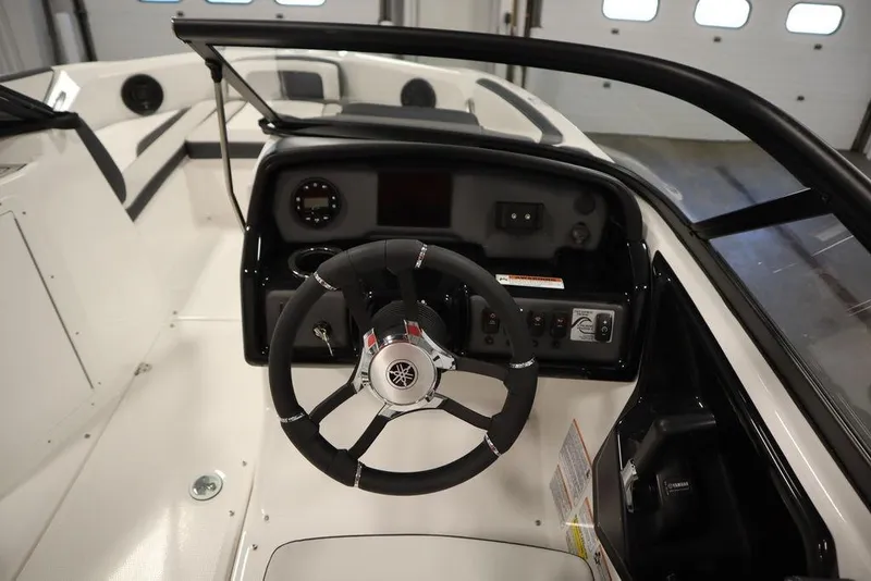 Slide: The Image of 2025 Yamaha Boats SX195 cockpit with steering wheel and dashboard controls. - 22