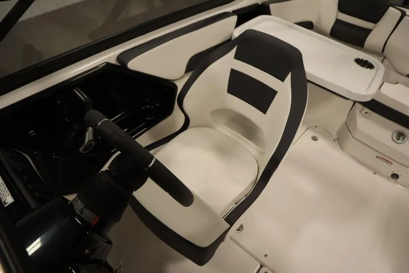 Slide: The Image of 2025 Yamaha Boats SX195 interior with steering wheel and seating area. - 26