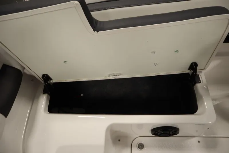 Slide: The Image of Open storage compartment in 2025 Yamaha Boats SX195, showcasing spacious interior design. - 31