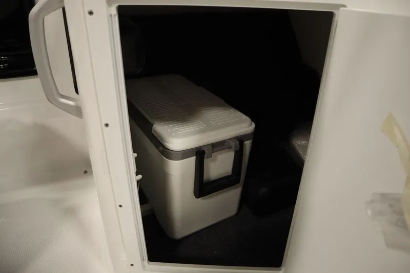 Slide: The Image of Storage compartment with cooler inside 2025 Yamaha Boats SX195. - 35