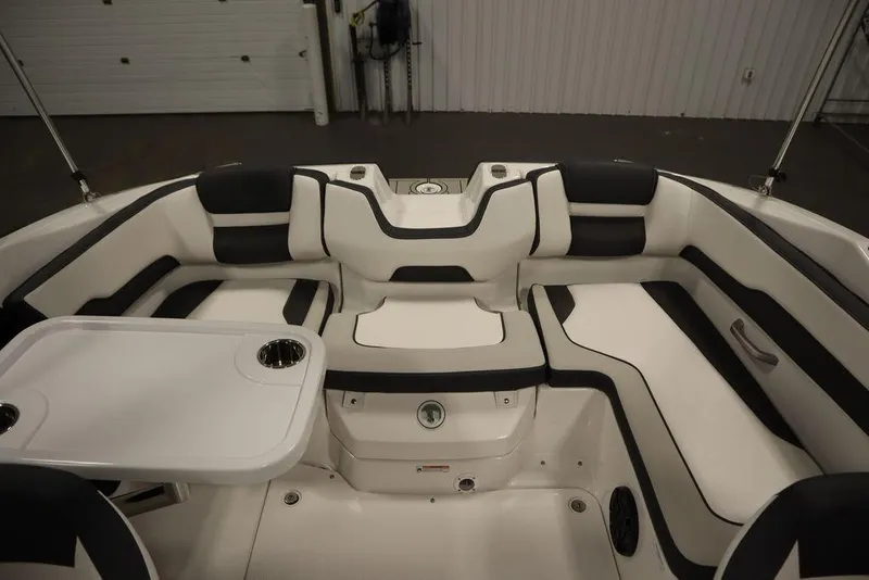 Slide: The Image of 2025 Yamaha Boats SX195 interior with sleek seating and built-in cup holders. - 36