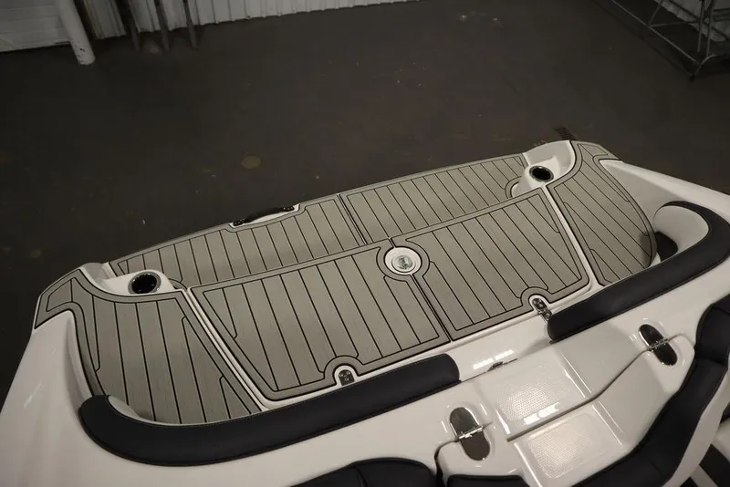 Slide: The Image of 2025 Yamaha Boats SX195 swim platform with sleek, modern design and integrated cup holders. - 38