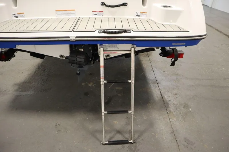 Slide: The Image of 2025 Yamaha Boats SX195 rear view with swim platform and ladder. - 44