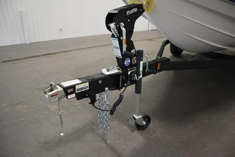 Slide: The Image of Trailer hitch of 2025 Yamaha Boats SX195, featuring secure attachment and safety chains. - 48