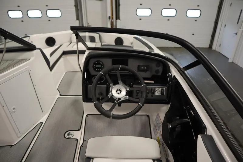 Slide: The Image of 2025 Yamaha Boats SX195 cockpit with steering wheel and dashboard controls. - 11