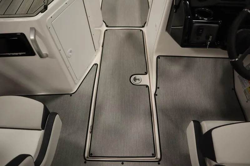 Slide: The Image of 2025 Yamaha Boats SX195 interior with sleek, modern flooring and seating design. - 22