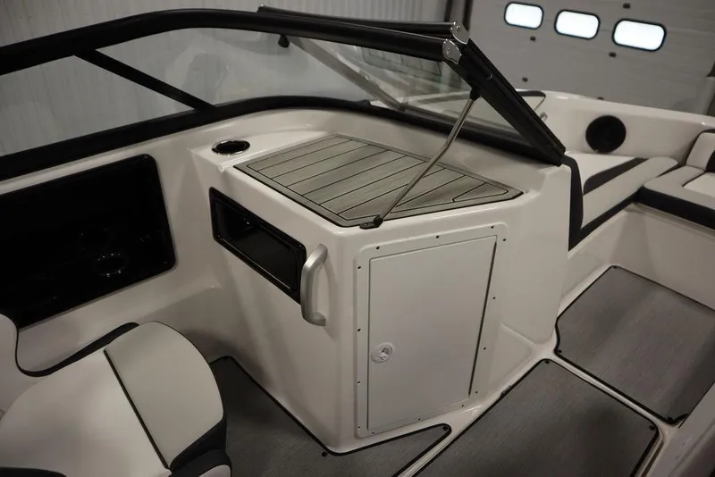Slide: The Image of 2025 Yamaha Boats SX195 interior with sleek seating and modern dashboard design. - 25