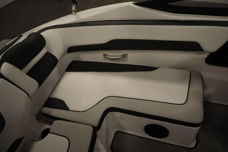 Slide: The Image of 2025 Yamaha Boats SX195 interior seating with sleek black and white upholstery design. - 29