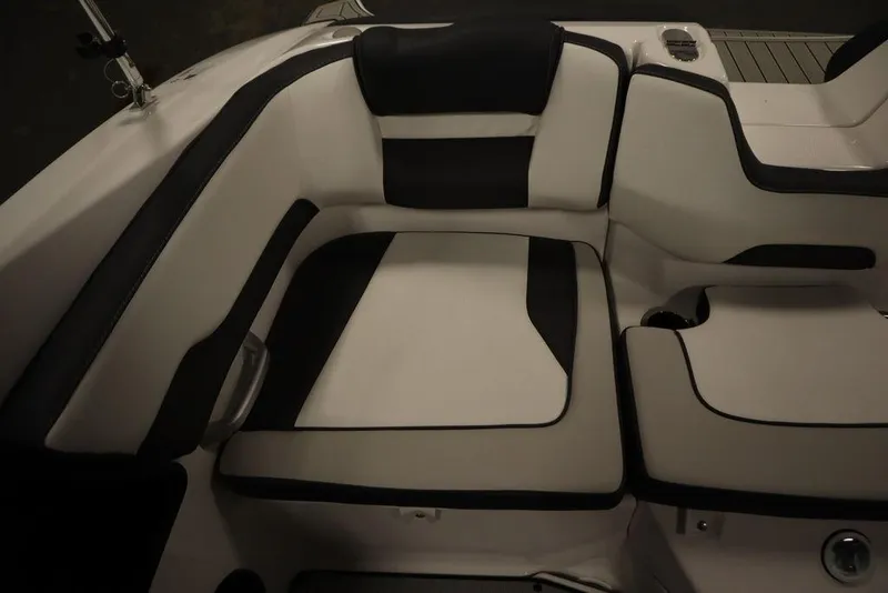 Slide: The Image of 2025 Yamaha Boats SX195 interior seating with black and white upholstery. - 30