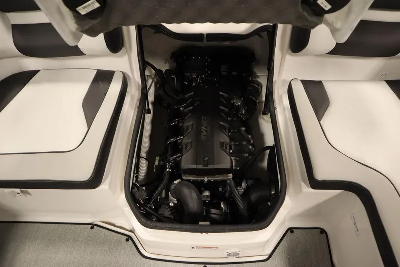 Slide: The Image of 2025 Yamaha Boats SX195 engine compartment with sleek interior seating design. - 31