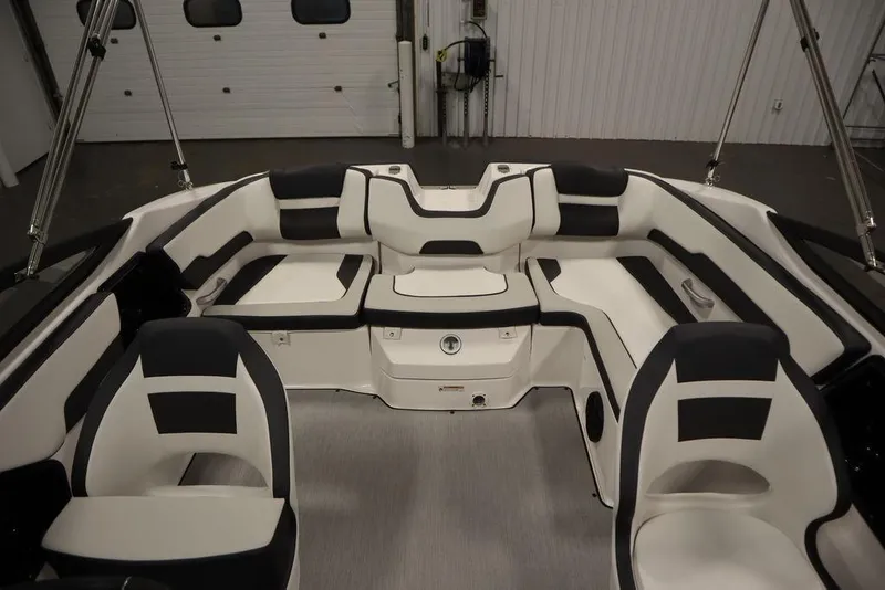 Slide: The Image of 2025 Yamaha Boats SX195 interior with sleek black and white seating design. - 32