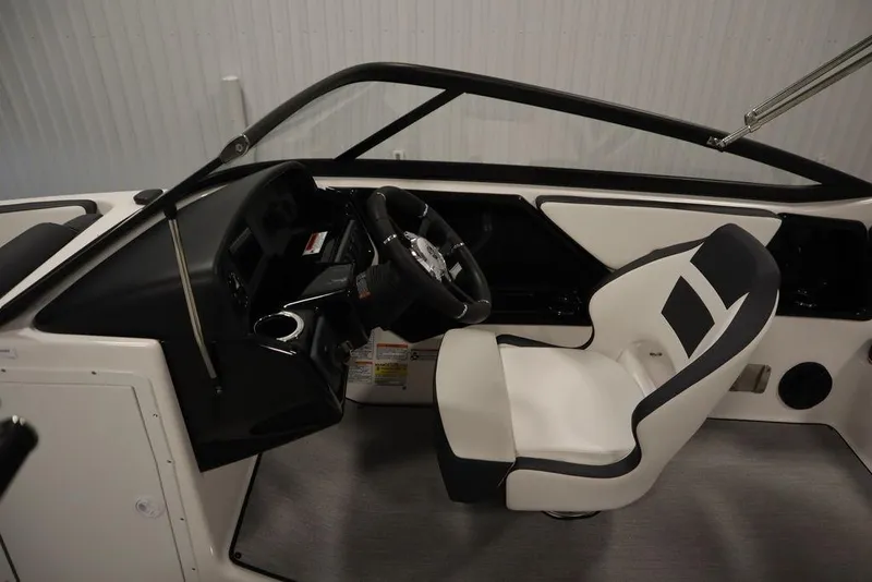 Slide: The Image of 2025 Yamaha Boats SX195 interior with steering wheel and captain's seat. - 9