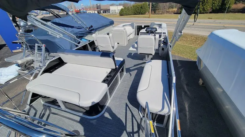 Slide: The Image of 2024 Godfrey Sweetwater 2286 SFL pontoon boat interior with spacious seating and modern design. - 5