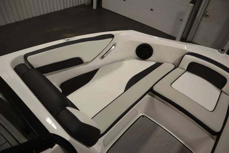 Slide: The Image of 2025 Yamaha Boats 195 SX interior seating with sleek black and white design. - 12