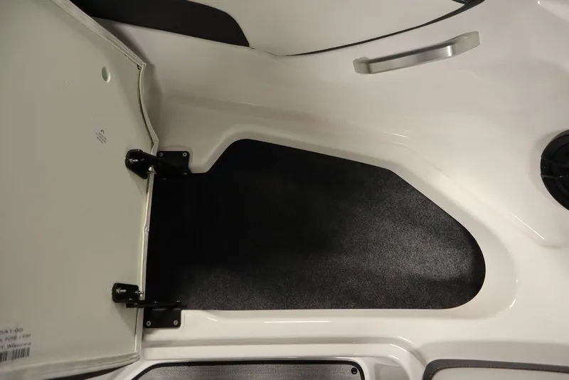 Slide: The Image of Interior view of 2025 Yamaha Boats 195 SX, featuring storage compartment and sleek design. - 13